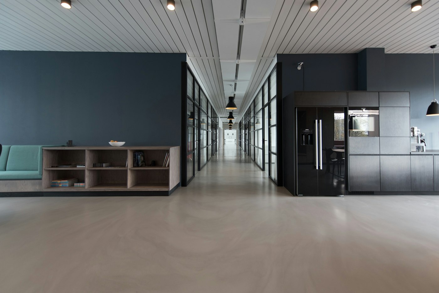 Modern office corridor with glass partitions